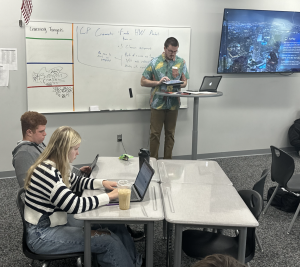 In April Martin's CP Geometry class, student teacher Connor Grant goes over notes from the lesson. In addition to being a Gretna alum, Grant's sister, freshman Morgan Grant, is in Martin's CP Geometry class.